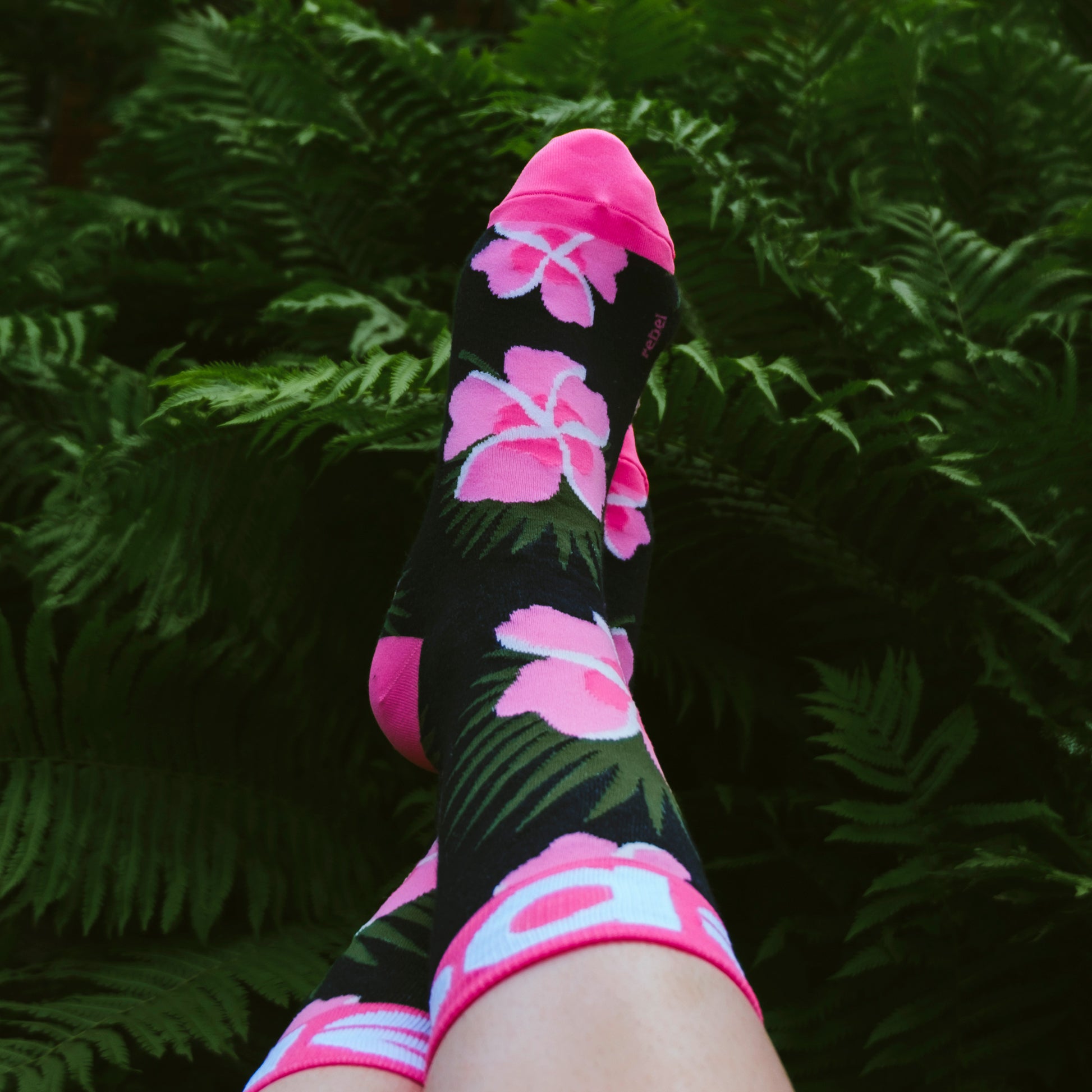 Order now and take your sock game to the next level with Rebel Fashion's Tropical Flower Socks!